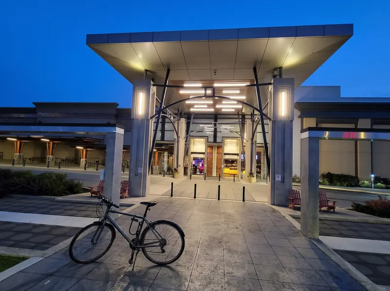 Bicycle with a U-lock by the casino entrance at dusk