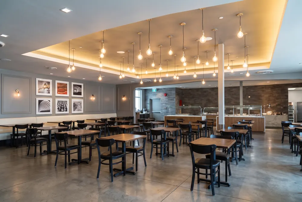 Empty restaurant under a cluster of hanging bulbs